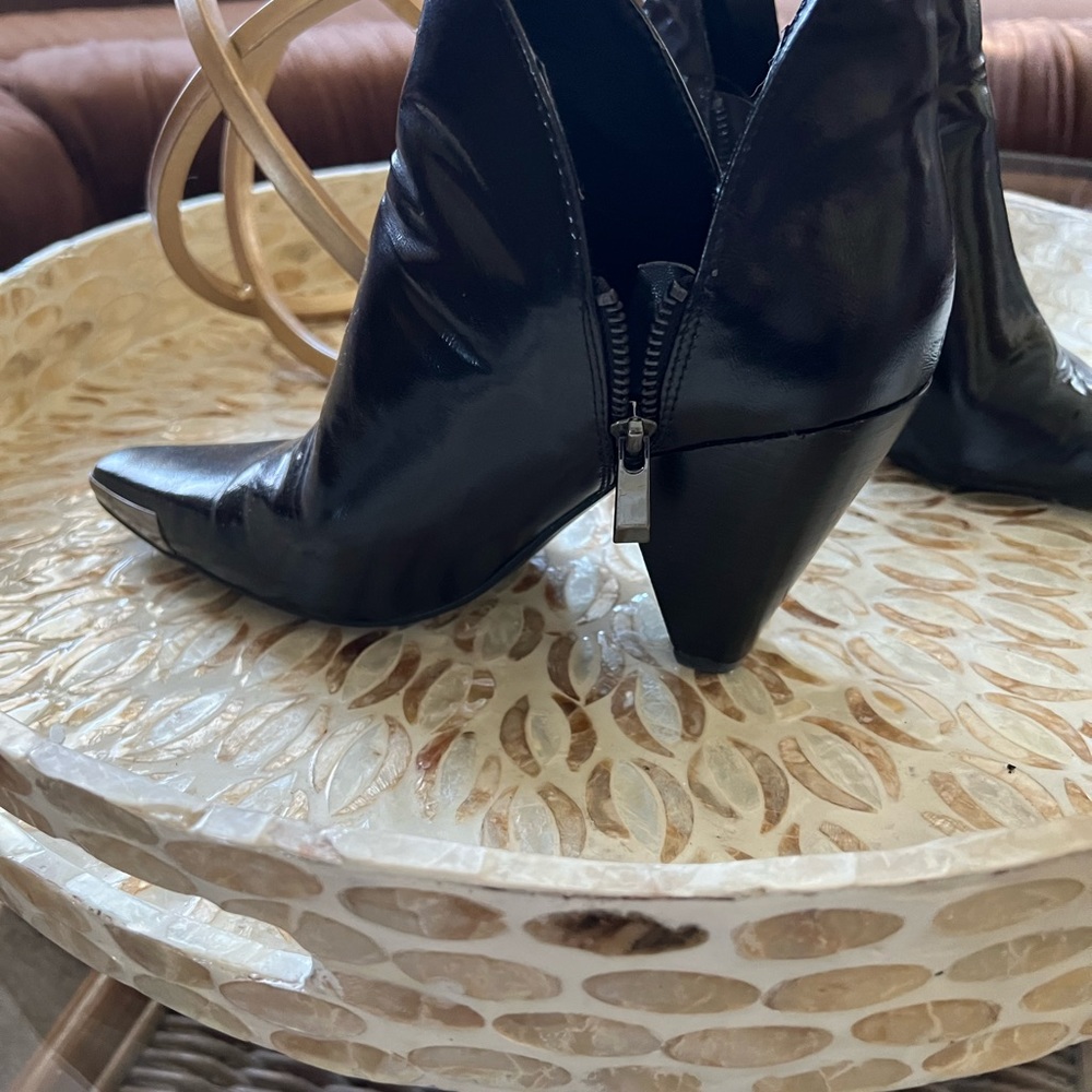 Black Cowboy style booties with metal tip around front toe area